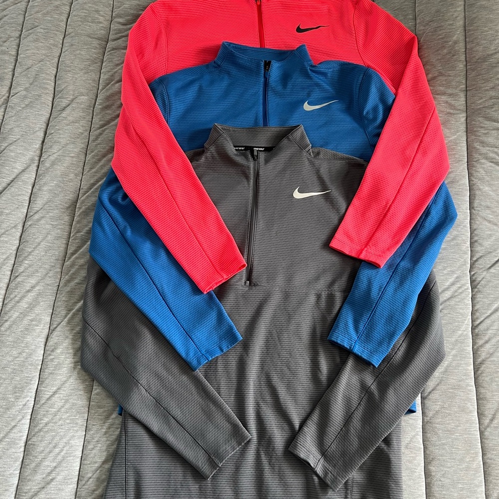 Nike AeroReact Golf Pullovers in Coral, Blue, and Gray